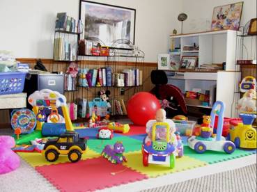 Grandma's Daycare play area with books, activities, and toys. Call Grandma's Daycare 785.733.2272.